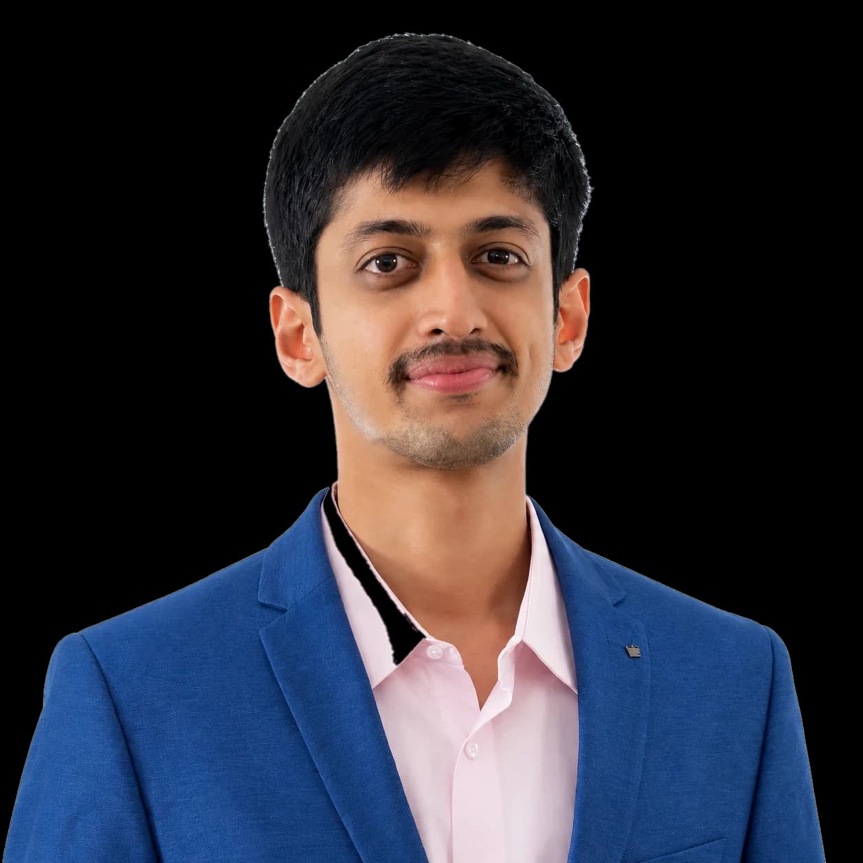 Portrait of Dr Dhanwanth Chigurupati in a blue blazer and pale pink shirt.
